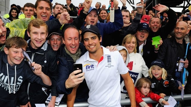 Alastair Cook poses with England fans after retaining the Ashes