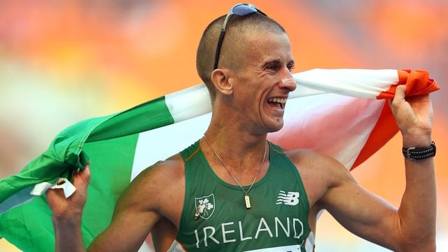Rob Heffernan celebrates with the tri-colour after winning gold in the 50km walk at the World Athletics Championships