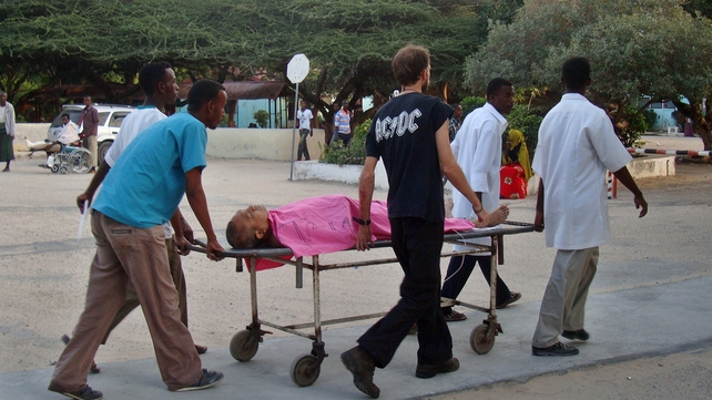Hospital staff and a colleague help a wounded MSF foreign aid worker after a Somali gunman opened fire on an MSF compound Hospital staff and a colleague help a wounded MSF foreign aid worker after a Somali gunman opened fire on an MSF compound