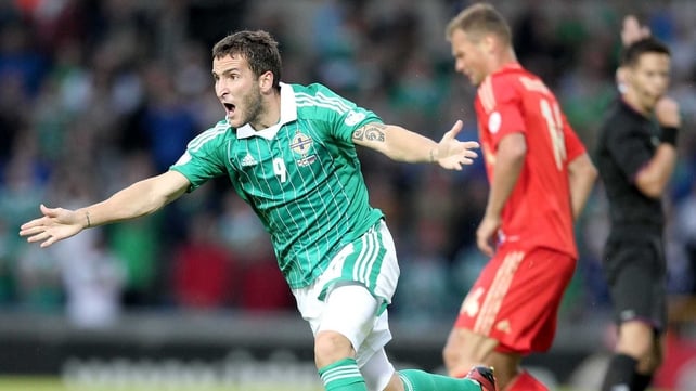 Northern Ireland's Niall McGinn with Russia's Vasilyi Berezutskyi