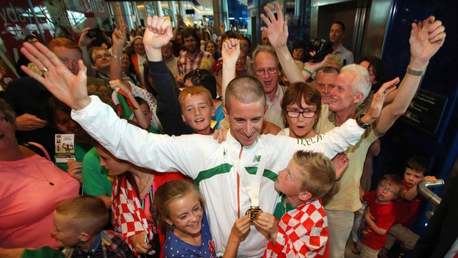 Rob Heffernan is welcomed home by his children Meghan (10) and Cathal (8)