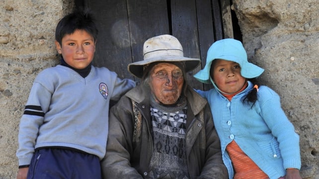 Mr Flores pictured outside his home with his great grand-children Edgar and Gloria