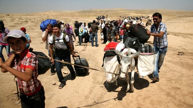 Syrian refugees cross the border into the northern Iraqi region of Kurdistan Syrian refugees cross the border into the northern Iraqi region of Kurdistan