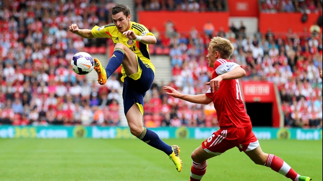 Adam Johnson controls under pressure from James Ward-Prowse