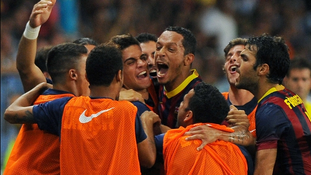 Adriano is mobbed following his goal