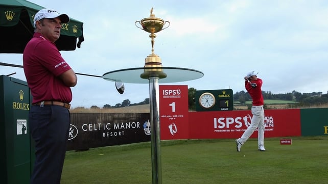 Espen Kofstad hits his opening tee shot under the watchful eye of Ryder Cup captain Paul McGinley