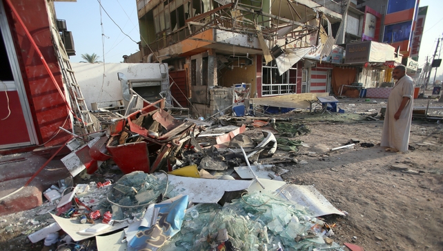 A man inspects the damage at a restaurant in the Karrada district of Baghdad following a car bomb attack A man inspects the damage at a restaurant in the Karrada district of Baghdad following a car bomb attack