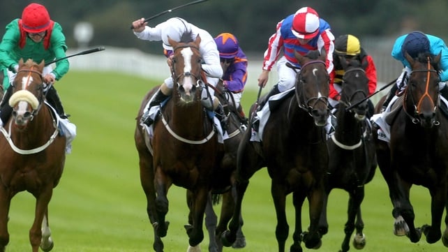 Royal Diamond (red and white cap) pulling away to win the 2012 Irish St Leger at the Curragh
