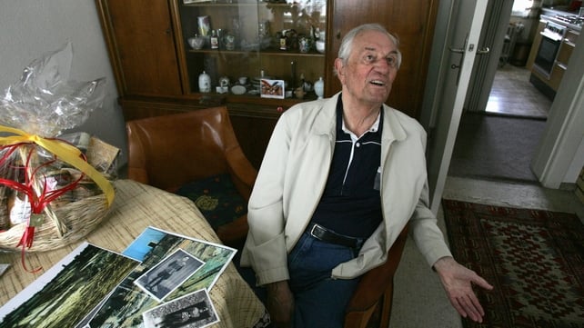Rochus Misch sitting in his home in Berlin in 2005, with pictures of himself during the war Rochus Misch sitting in his home in Berlin in 2005, with pictures of himself during the war
