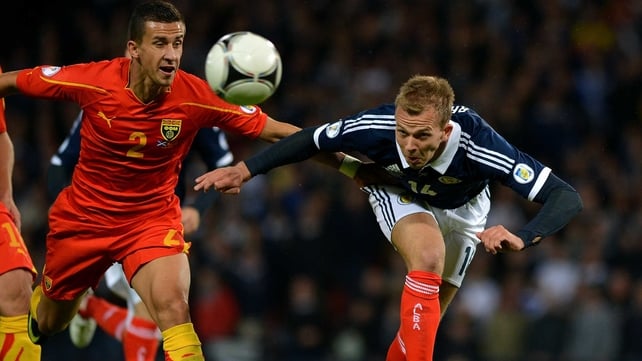 Jordan Rhodes of Scotland gets there ahead of Macedonia's Daniel Georgievski