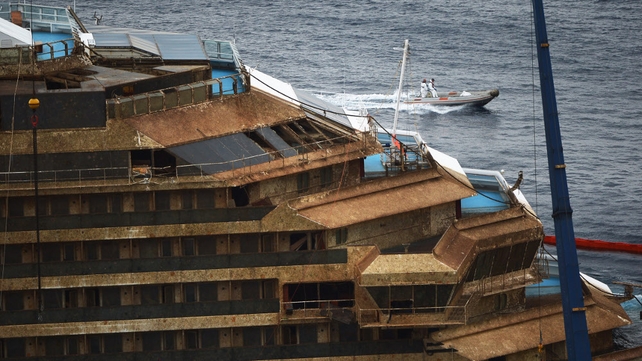 Costa Concordia shipwreck pulled upright off Italian island of Giglio