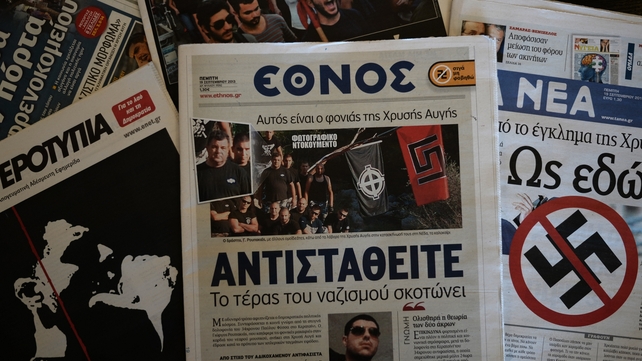 A front-page picture in centre-left daily Ethnos (C) shows the self-confessed killer at a Golden Dawn summer camp gathering A front-page picture in centre-left daily Ethnos (C) shows the self-confessed killer at a Golden Dawn summer camp gathering