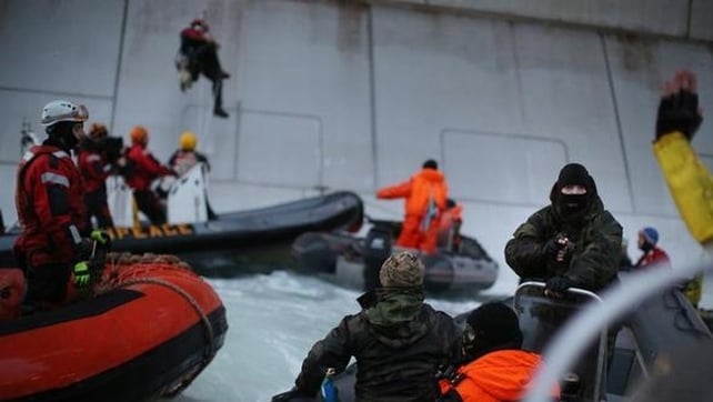 Two Greenpeace activists scaled the side of the platform and were arrested (Denis Sinyakov/Greenpeace) Two Greenpeace activists scaled the side of the platform and were arrested (Denis Sinyakov/Greenpeace)