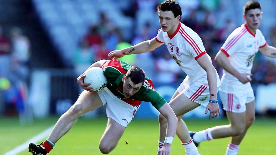 Diarmuid O'Connor tries to escape the attention of Tyrone's Ronan Nugent