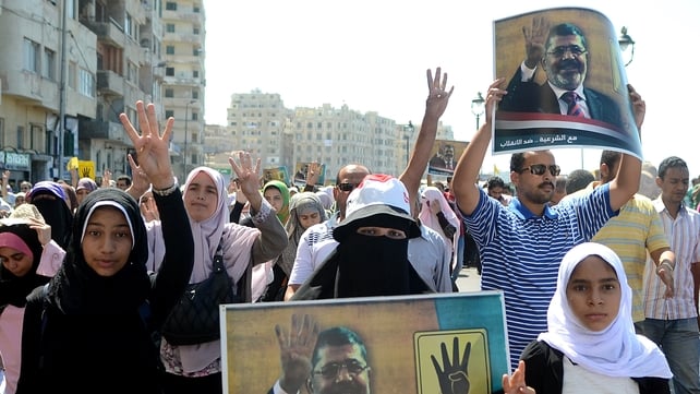 Supporters of Mohammed Mursi marching in Alexandria on Friday Supporters of Mohammed Mursi marching in Alexandria on Friday