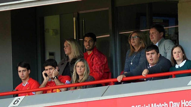 Luis Suarez watching from a hospitality box during Liverpool's defeat to Southampton on Saturday