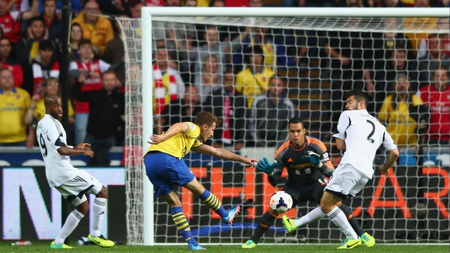 Arsenal's Aaron Ramsey fires past Michel Vorm in the Swansea goal