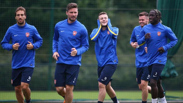 Jack Wilshere shares a joke with Arsenal team-mates