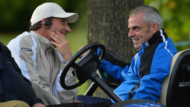 Europe captain Jose Maria Olazabal talks with Ryder Cup captain Paul McGinley during today's foursomes