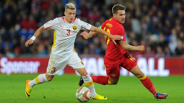 Wales player Aaron Ramsey (r) challenges Ezgjan Alioski of Macedonia
