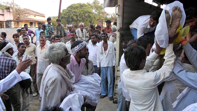 Bodies of Hindu devotees are loaded onto a truck following a stampede outside the Ratangarh Temple in Datia district Bodies of Hindu devotees are loaded onto a truck following a stampede outside the Ratangarh Temple in Datia district