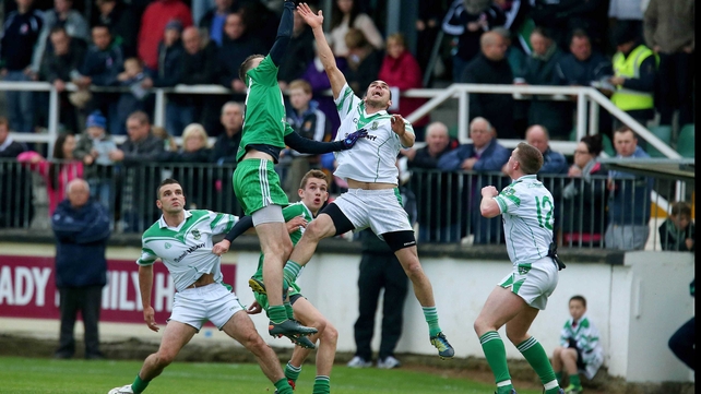 Moorefield's James Longergan (l) and Declan McKenna of Sarsfields contest a high ball