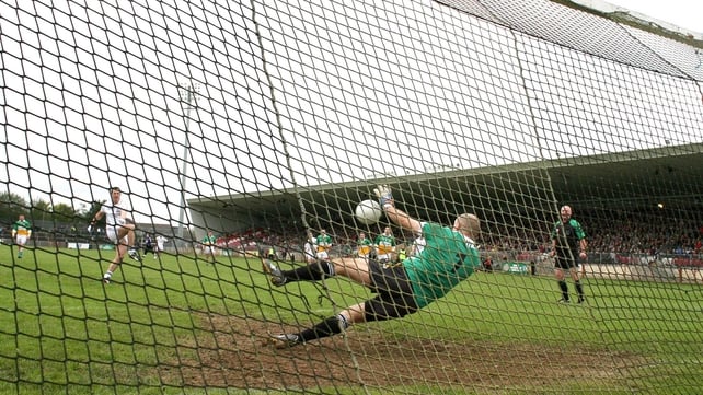 Carrickmore goalkeeper Plunkett McCallan saves a penalty taken by Colm Doris of Clonoe