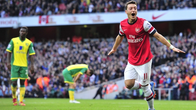 Arsenal's German midfielder Mesut Ozil celebrates after scoring against Norwich