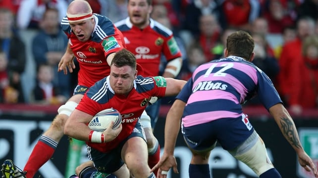 Munster's Dave Kilcoyne is tackled by Jonny Bentley of Gloucester
