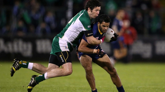 Seán Cavanagh gets to grips with Daniel Wells