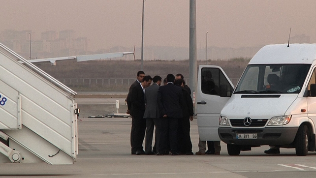 Some of the hostages wait to board a plane after their release Some of the hostages wait to board a plane after their release