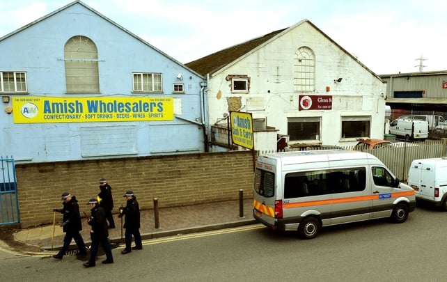 Police outside east London shop where owner Shammi Atwal was thrown under a passing lorry and killed after a robbery Police outside east London shop where owner Shammi Atwal was thrown under a passing lorry and killed after a robbery