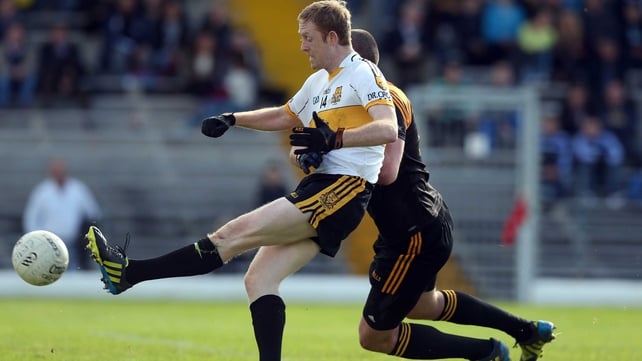 Dr Crokes' Colm Copper scores a goal despite the attention of Kerry team-mate Kieran Donaghy of Austin Stacks