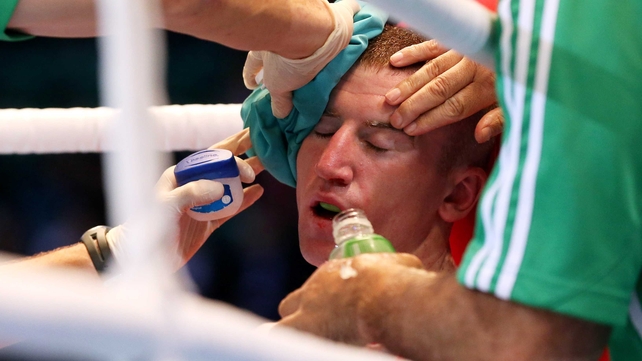 Paddy Barnes receives treatment to his head injury between rounds