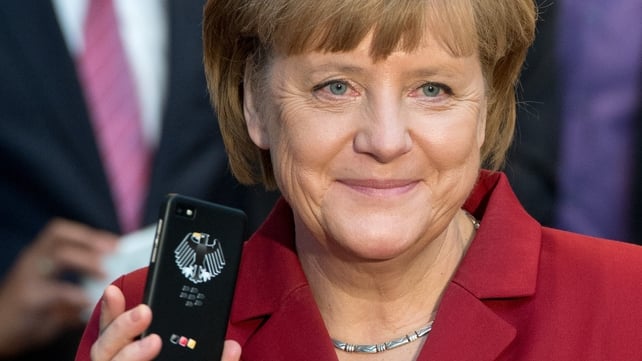 German Chancellor Angela Merkel holding a tapping proof BlackBerry mobile device in March of this year German Chancellor Angela Merkel holding a tapping proof BlackBerry mobile device in March of this year