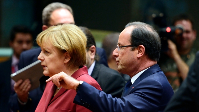 French President Francois Hollande talks with German Chancellor Angela Merkel French President Francois Hollande talks with German Chancellor Angela Merkel