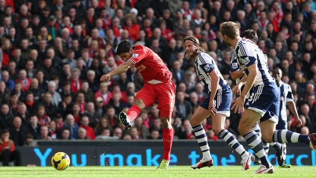 Luis Suarez scores the opening goal at Anfield
