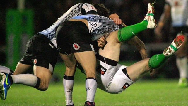 Fiji's Ashton Sims and Aaron Groom tackle Eamon O'Carroll of Ireland