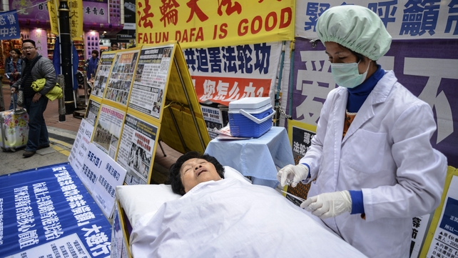 A protest with a mock operation earlier this year in Hong Kong against forced organ harvesting in China A protest with a mock operation earlier this year in Hong Kong against forced organ harvesting in China