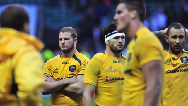 Australian players show their disappointment after losing to England