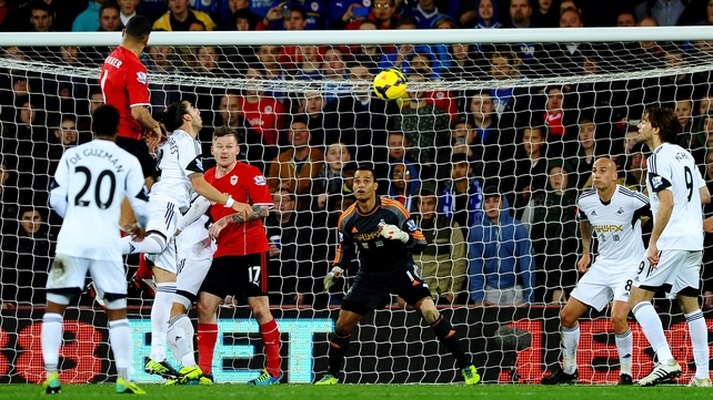 Steven Caulker out-jumps the Swansea defence to score