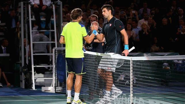 Novak Djokovic of Serbia is congratulated by David Ferrer of Spain in the final after Djokovic won in straight sets
