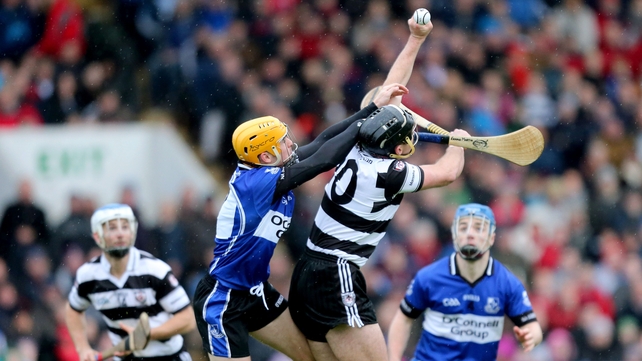 Sarsfields' Eanna Martin and Padraig O'Shea of Midleton