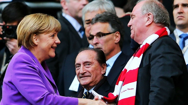 Uli Hoeness (r) admitted to gambling bigger and bigger amounts and taking a major hit as the dotcom bubble burst