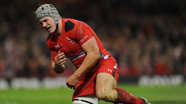 Jonathan Davies reacts after injuring his shoulder