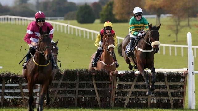 Minella Foru ridden by Tony McCoy (far right) comes home to win the second race of the day