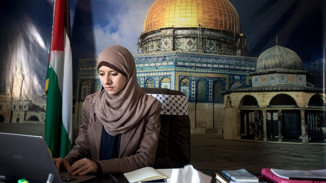Isra Al-Modallal's job is to convey the views of the Hamas government Isra Al-Modallal's job is to convey the views of the Hamas government
