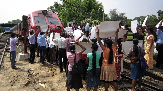Pro-government activists block a train carrying Britain's Channel 4 television crew who made an award-winning documentary on alleged warcrimes in Sri Lanka Pro-government activists block a train carrying Britain's Channel 4 television crew who made an award-winning documentary on alleged warcrimes in Sri Lanka