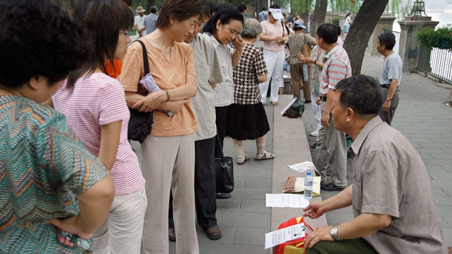 Chinese parents try to match their children at Zhongshan park in Beijing Chinese parents try to match their children at Zhongshan park in Beijing