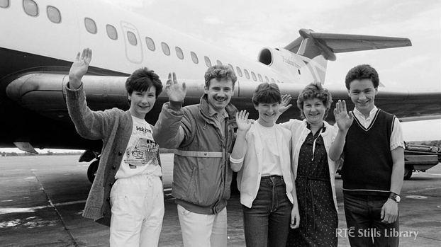Presenter Barry Lang (second left) with 'Poparama' competition winners in 1984, but who are they?